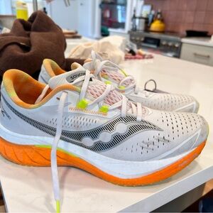 Three pairs of Saucony Men’s running shoes.